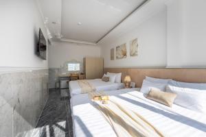 Postel nebo postele na pokoji v ubytování Nghia Lan Hotel