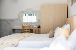 Postel nebo postele na pokoji v ubytování Nghia Lan Hotel