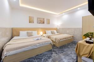 Postel nebo postele na pokoji v ubytování Nghia Lan Hotel