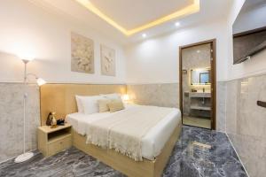 Postel nebo postele na pokoji v ubytování Nghia Lan Hotel