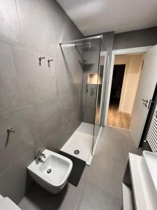 a bathroom with a sink and a shower at MARY Apartment in Tarvisio +28 photos