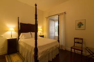 En eller flere senge i et værelse på Casa da Rocha Quebrada