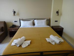 Postel nebo postele na pokoji v ubytování 9 Queens Spa Hotel