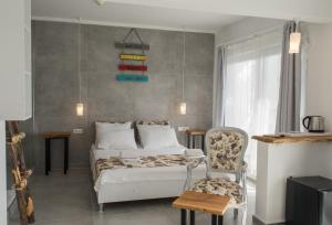 Postel nebo postele na pokoji v ubytování Pataros Hotel