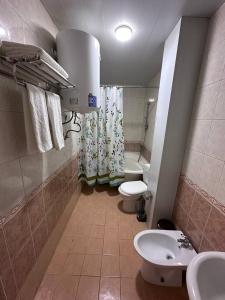 a bathroom with two toilets and a sink at Grand Silk Road in Samarkand +28 photos