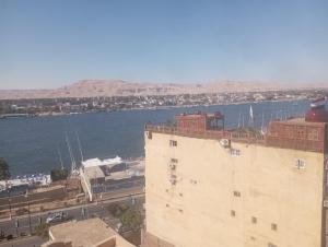 a view of a body of water from a building at شقه على النيل in Luxor