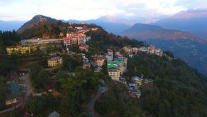 an aerial view of a town on a mountain at Hotel Sikkim Tourist Centre in Pelling