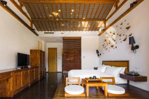 TV a/nebo společenská místnost v ubytování Huangshan Shanshuijian Wei Boutique Hotel