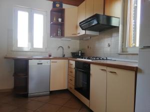 Kuchyň nebo kuchyňský kout v ubytování Apartments Renata - Brseč + 37 fotografií