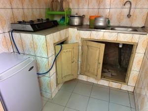 Kuchyň nebo kuchyňský kout v ubytování Appartement cosy