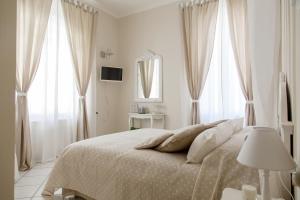 Ένα ή περισσότερα κρεβάτια σε δωμάτιο στο La Maison Des Anges