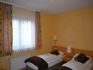 Postel nebo postele na pokoji v ubytování Hotel-Gasthof Rotes Roß