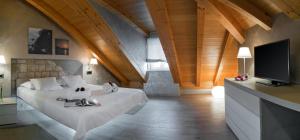 a bedroom with a large bed with a flat screen tv at Villa Luna Trogir in Trogir