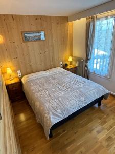 Postel nebo postele na pokoji v ubytování Vue Mont Blanc et toute la chaîne