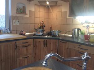 A kitchen or kitchenette at Apartments for Rent near Budapest