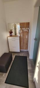 a small room with a black rug and a door at Ferienwohnung Watzmannglück in Berchtesgaden