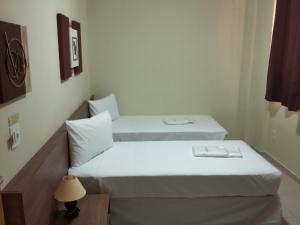 Llit o llits en una habitació de Hotel Mont Rey