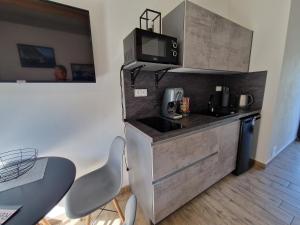 Kuchyň nebo kuchyňský kout v ubytování Moderní byt v Relax Vila Lipno u pláže Windy Point