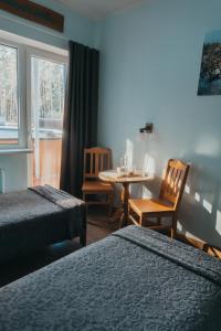 Postel nebo postele na pokoji v ubytování Tartumaa Tervisespordikeskus + 25 fotografií