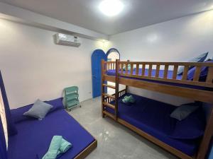 Postel nebo postele na pokoji v ubytování Aina Hannah Family Resort's Greek Unit