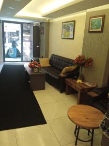 a living room with a couch and a table at Yellow Bull Istanbul hotel in Istanbul