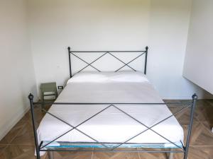 En eller flere senge i et værelse på Villa Rosaria