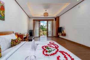 Postel nebo postele na pokoji v ubytování Uma Nandhi Villa Ubud