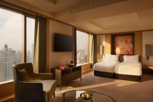 Ein Bett oder Betten in einem Zimmer der Unterkunft Banyan Tree Bangkok
