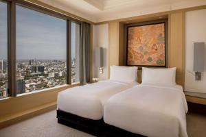 Ein Bett oder Betten in einem Zimmer der Unterkunft Banyan Tree Bangkok