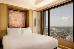 Ein Bett oder Betten in einem Zimmer der Unterkunft Banyan Tree Bangkok