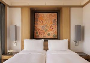 Ein Bett oder Betten in einem Zimmer der Unterkunft Banyan Tree Bangkok