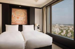 Ein Bett oder Betten in einem Zimmer der Unterkunft Banyan Tree Bangkok