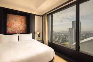 Ein Bett oder Betten in einem Zimmer der Unterkunft Banyan Tree Bangkok