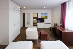 Postel nebo postele na pokoji v ubytování Hotel Rottal + 29 fotografií