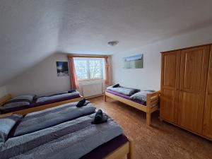 Postel nebo postele na pokoji v ubytování Penzion Pochop