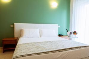 Postel nebo postele na pokoji v ubytování Easy Green Hotel
