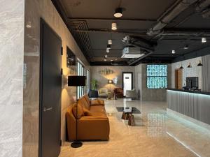 a living room with a couch and a table at NBG d 'amore Appart in Batumi +41 photos