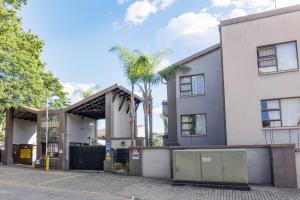 an empty parking lot in front of a building at Pamuzinda Airbnb at Urban Cove in Nelspruit