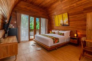 Postel nebo postele na pokoji v ubytování Uma Nandhi Villa Ubud