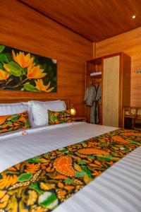 Postel nebo postele na pokoji v ubytování Uma Nandhi Villa Ubud
