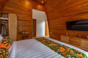 Postel nebo postele na pokoji v ubytování Uma Nandhi Villa Ubud