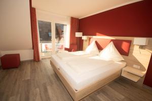 Postel nebo postele na pokoji v ubytování Hotel Sonne am Meer