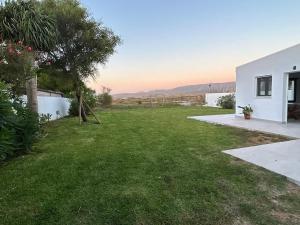 a view of a yard with a house at Villa Marismas in Barbate