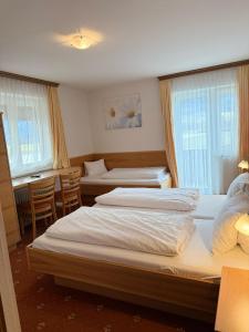 Voodi või voodid majutusasutuse Pension Plattenhof toas