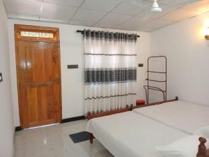 Una cama o camas en una habitación de Amila Guest