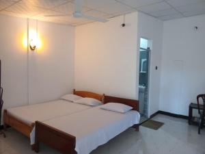 Una cama o camas en una habitación de Amila Guest