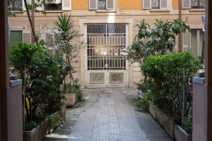 an entrance to a building with a door and plants at Milan Retreats in Milan