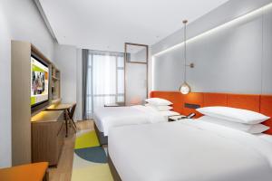 Letto o letti in una camera di Home2 Suite by Hilton Foshan Lishui