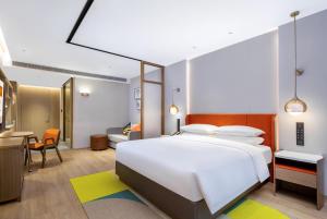 Letto o letti in una camera di Home2 Suite by Hilton Foshan Lishui