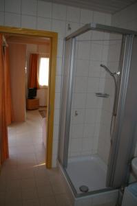 a bathroom with a shower and a toilet in it at BnB Villa Moncalme in Travers